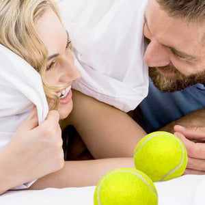 Laughing couple who tried the old tennis ball in the pj's trick. Sure stops one from snoring, but not nearly as comfortable as wearing a SnoreMeds anti-snoring mouthpiece!
